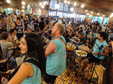 Musicians perform for an excited crowd in the dining hall